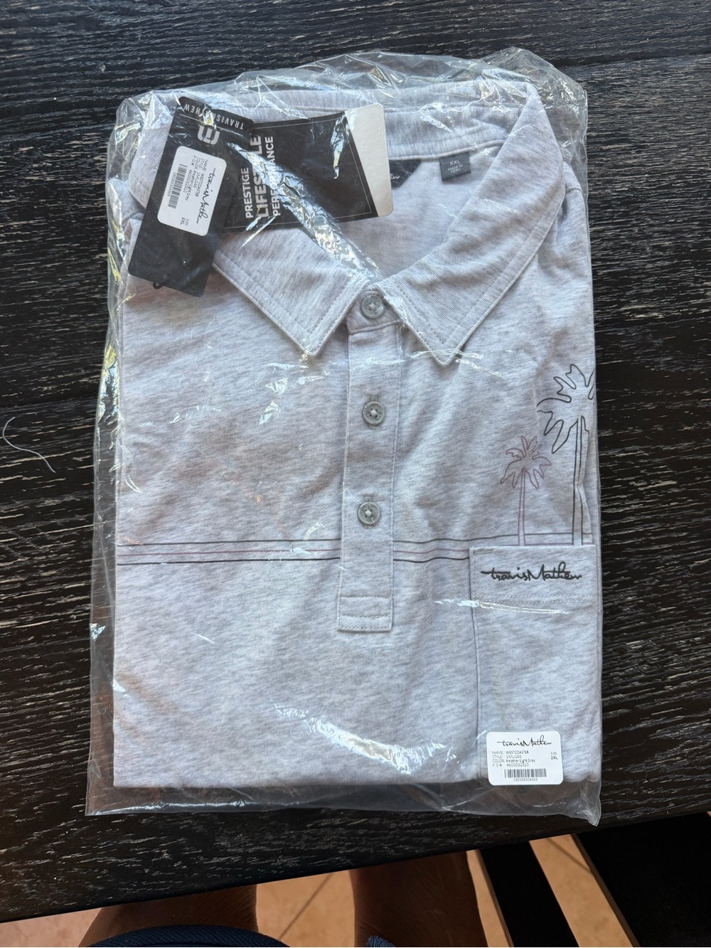 Travis Mathew Heather Gray Polo with Subtle Palm Graphic